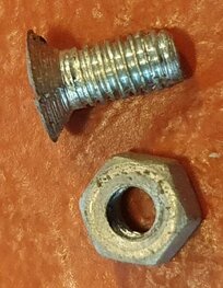 65-8317 Screw + nut for round plastic tankbadge